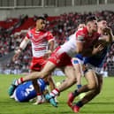 Jack Welsby of St Helens battles for possession with James Bentley of Leeds Rhinos during the Betfred Super League between St Helens and Leeds Rhinos at Totally Wicked Stadium on June 23, 2022