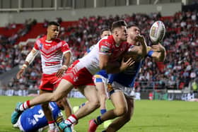 Jack Welsby of St Helens battles for possession with James Bentley of Leeds Rhinos during the Betfred Super League between St Helens and Leeds Rhinos at Totally Wicked Stadium on June 23, 2022