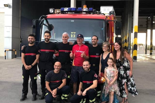 Nick Dalby is welcomed by firefighters in Torrevieja, Spain. 
