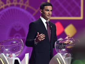 Former Australian footballer Tim Cahill speaks on stage during the draw for the 2022 World Cup in Qatar at the Doha Exhibition and Convention Center 