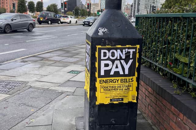 Don’t Pay UK posters are scattered along Liverpool’s waterfront.