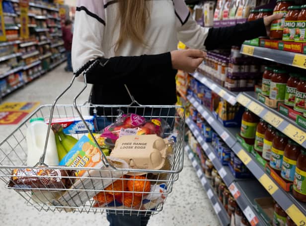 <p>A woman holds a shopping basket of groceries. Last week, the UK Office for National Statistics reported an 6% average increase of food and drink prices year on year, but some staples, such as milk and pasta, had risen by more than 10%. </p>