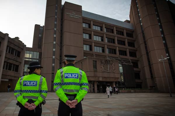 Police officers guard the Liverpool court buildings. Photo: Colin McPherson/Getty Images