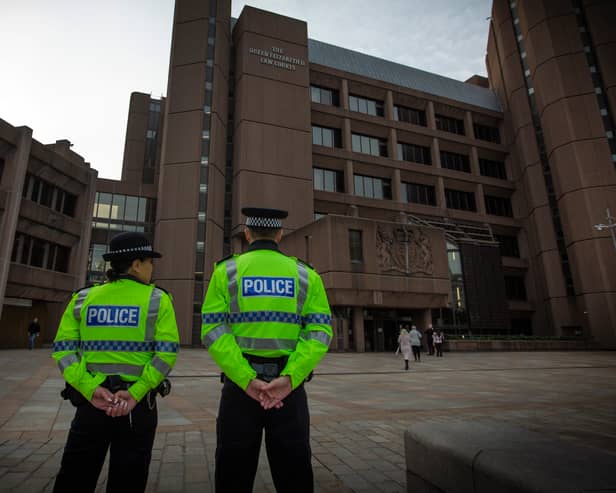 Police officers guard the Liverpool court buildings. Photo: Colin McPherson/Getty Images