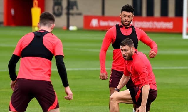 Alex Oxlade-Chamberlain and James Milner of Liverpool during a training session at AXA Training Centre on October 14, 2022 in Kirkby, England. (Photo by Andrew Powell/Liverpool FC via Getty Images)