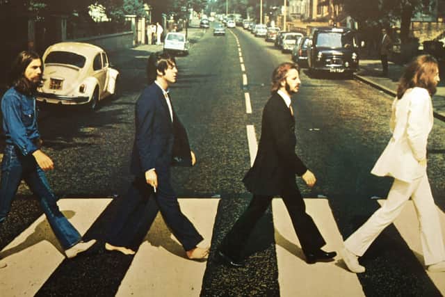 The Beatles on the Abbey Road zebra crossing.  