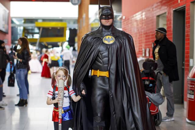 A father and daughter dress up as Batman and Harley Quinn. Image: Tolga Akmen/AFP/Getty Images.