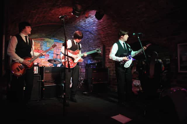 Tribute band the Mersey Beatles play on the stage of the famous Cavern Club on the 50th anniversary of the first time The Beatles played at the basement club on February 9, 2011 in Liverpool, England.  (Photo by Christopher Furlong/Getty Images)