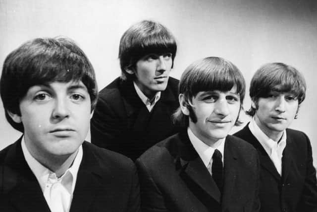 Portrait of British pop group The Beatles (L-R) Paul McCartney, George Harrison, Ringo Starr and John Lennon (Photo by Central Press/Getty Images)