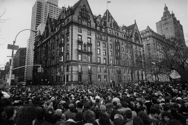 Crowds gathering outside the home of John Lennon in New York after the news that he had been shot and killed. (Photo by Keystone/Getty Images)