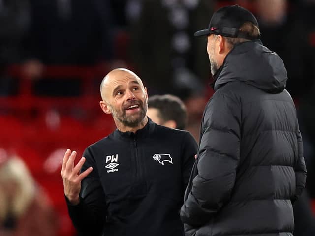 Derby manager Paul Warne speaks to Liverpool boss Jurgen Klopp. Picture: Nathan Stirk/Getty Images