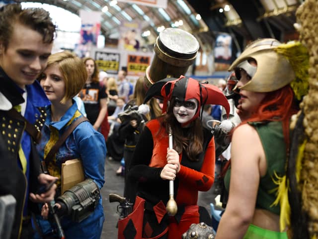 Cosplayers dressed as fantasy and science fiction characters attend the second day of the MCM Comic Con in the Manchester Central exhibition venue in Manchester, north west England on July 26, 2015. AFP PHOTO / OLI SCARFF        (Photo credit should read OLI SCARFF/AFP via Getty Images)