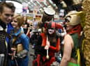Cosplayers dressed as fantasy and science fiction characters attend the second day of the MCM Comic Con in the Manchester Central exhibition venue in Manchester, north west England on July 26, 2015. AFP PHOTO / OLI SCARFF        (Photo credit should read OLI SCARFF/AFP via Getty Images)
