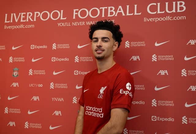 <p> Curtis Jones of Liverpool signing a contract extension at AXA Training Centre on November 17, 2022 in Kirkby, England. (Photo by Andrew Powell/Liverpool FC via Getty Images)</p>