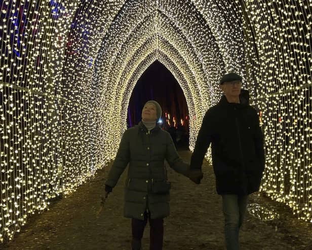 The Christmas Cathedral lets visitors walk through a tunnel of more than 10,000 pea lights