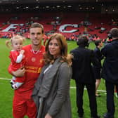Jordan Henderson of Liverpool with his wife and child at the end of the Barclays Premier League match between Liverpool and Newcastle United at Anfield on May 11, 2014 in Liverpool, England.  (Photo by Andrew Powell/Liverpool FC via Getty Images)