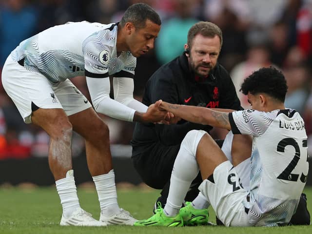 Luis Diaz receives treatment during Liverpool’s loss to Arsenal in October. Picture:  ADRIAN DENNIS/AFP via Getty Images