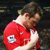 Wayne Rooney kisses the Manchester United badge after scoring against Everton in 2007. Picture: PAUL ELLIS/AFP via Getty Images