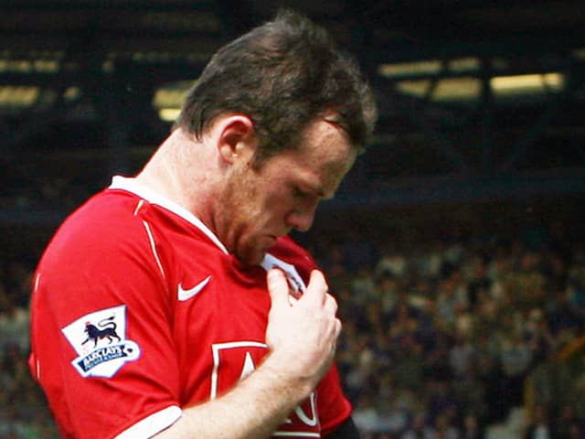 Wayne Rooney kisses the Manchester United badge after scoring against Everton in 2007. Picture: PAUL ELLIS/AFP via Getty Images