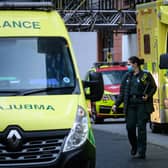 A queue of ambulances are seen outside a hospital. Image: Leon Neal/Getty Images