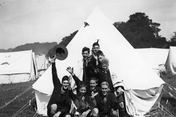 Canadian scouts waving from their tent during the Great Jamboree at Birkenhead, 1929. Image: Topical Press Agency/Getty Images