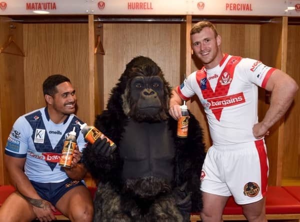 Saints’ players Sione Mata’utia (left) and Joey Lussick are introduced to the largest primate on the planet. 