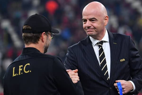 Jurgen Klopp is greeted by FIFA President Gianni Infantino after Liverpool won the Club World Cup in 2019. Picture: GIUSEPPE CACACE/AFP via Getty Images