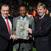  Pele is awarded a plaque by  former Liverpool chairman Ian Ayre and club legend Kenny Dalglish at Anfield. Picture: John Powell/Liverpool FC via Getty Images)