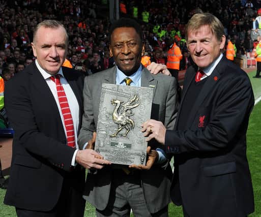  Pele is awarded a plaque by  former Liverpool chairman Ian Ayre and club legend Kenny Dalglish at Anfield. Picture: John Powell/Liverpool FC via Getty Images)