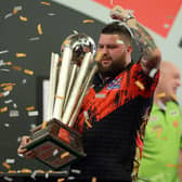 Michael Smith with the PDC World Darts Championship Trophy