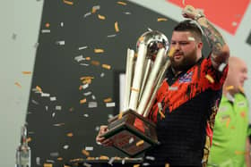 Michael Smith with the PDC World Darts Championship Trophy