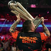  Michael Smith lifts the PDC World Darts Championship trophy. Image: Luke Walker/Getty Images
