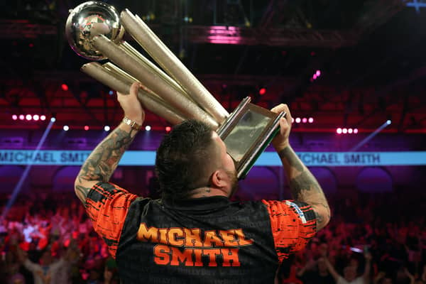  Michael Smith lifts the PDC World Darts Championship trophy. Image: Luke Walker/Getty Images
