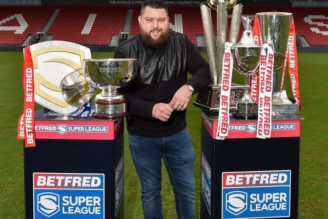 Michael Smith with prestigious trophies won by the club and his own trophies. Image: Bernard Platt
