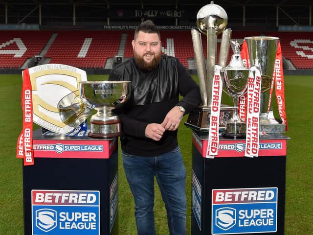Michael Smith with prestigious trophies won by the club and his own trophies. Image: Bernard Platt