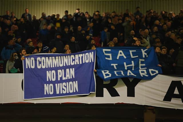 Everton fans display banners protesting the club board during the Emirates FA Cup Third Round match between Manchester United and Everton at Old Trafford on January 06, 2023 in Manchester, England. (Photo by Gareth Copley/Getty Images)