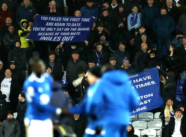 <p>Everton fans display banners protesting against the board.</p>