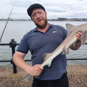 Ben Coba with a starry smooth-hound shark caught in Seacombe. Credit: Wirral Sea Angling Academy