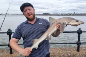 Ben Coba with a starry smooth-hound shark caught in Seacombe. Credit: Wirral Sea Angling Academy