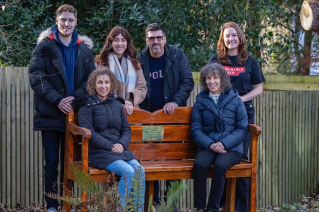 Gogglebox’s Leon and June’s family with Strawberry Field’s Adele Murphy (Employment Development Co-ordinator) sat on the memorial bench.