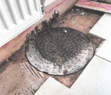 A manhole had been placed over a hole in the lounge of the Highgate Street property. Image: Liverpool City Council