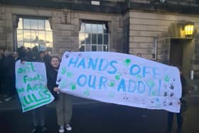 Protestors against “The Addy" a playground, being under threat before the meeting. Closing it has now been rejected by councillors. Credit: Ed Barnes