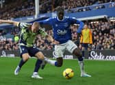 Amadou Onana of Everton battles for possession with Rasmus Kristensen of Leeds United during the Premier League match between Everton FC and Leeds United at Goodison Park on February 18, 2023 in Liverpool, England. (Photo by Clive Brunskill/Getty Images)