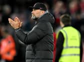 Jurgen Klopp manager of Liverpool showing his appreciation to the fans at the end of the UEFA Champions League round of 16 leg one match between Liverpool FC and Real Madrid at Anfield on February 21, 2023 in Liverpool, England. (Photo by Andrew Powell/Liverpool FC via Getty Images)