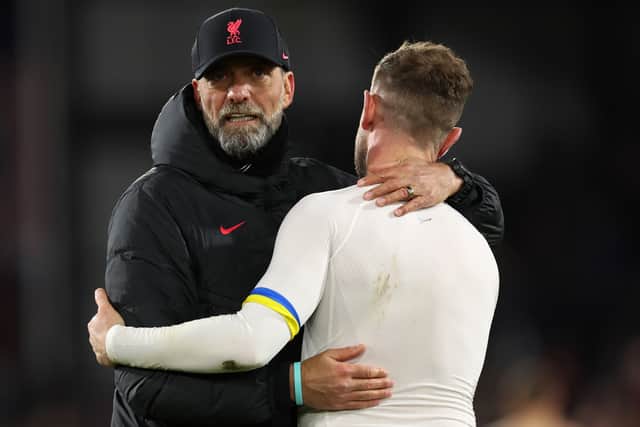 Jurgen Klopp, Manager of Liverpool, embraces Jordan Henderson of Liverpool, whilst wearing a Captain’s Armband featuring the colours of Ukraine, after the Premier League match between Crystal Palace and Liverpool FC at Selhurst Park on February 25, 2023 in London, England. (Photo by Julian Finney/Getty Images)
