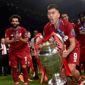 Roberto Firmino of Liverpool lifting the UEFA Champions League trophy at the end of the UEFA Champions League Final between Tottenham Hotspur and Liverpool at Estadio Wanda Metropolitano on June 01, 2019 in Madrid, Spain. (Photo by John Powell/Liverpool FC via Getty Images)