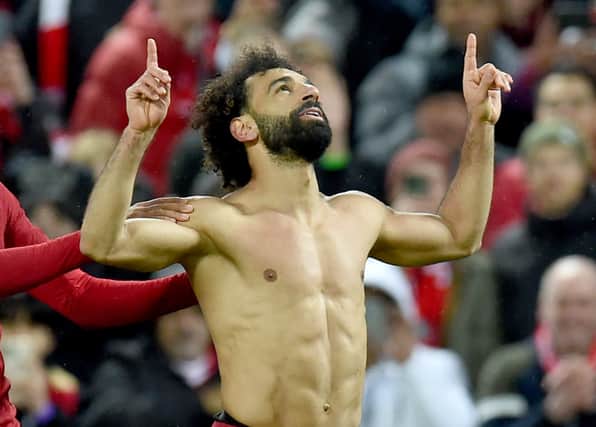 Mohamed Salah of Liverpool celebrates  after scoring the sixth goal  during the Premier League match between Liverpool FC and Manchester United at Anfield on March 05, 2023 in Liverpool, England. (Photo by John Powell/Liverpool FC via Getty Images)