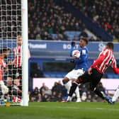 Demarai Gray of Everton scores a goal which was later disallowed for handball during the Premier League match between Everton FC and Brentford FC at Goodison Park on March 11, 2023 in Liverpool, England. (Photo by Naomi Baker/Getty Images)
