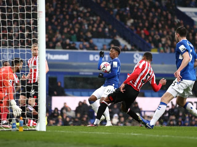 Demarai Gray of Everton scores a goal which was later disallowed for handball during the Premier League match between Everton FC and Brentford FC at Goodison Park on March 11, 2023 in Liverpool, England. (Photo by Naomi Baker/Getty Images)