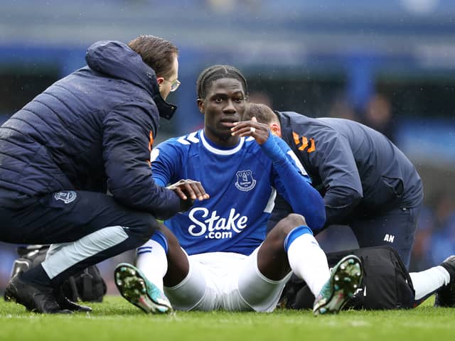 madou Onana of Everton receives medical treatment during the Premier League match between Everton FC and Brentford FC at Goodison Park on March 11, 2023 in Liverpool, England. (Photo by Naomi Baker/Getty Images)